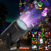 A rotating Christmas projector light casting colorful festive patterns onto a dark night scene.