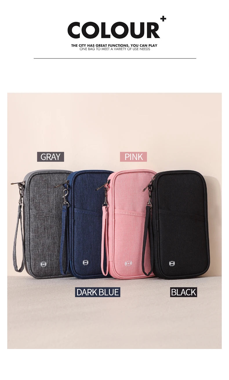 A collection of five RFID-blocking passport holders in gray, dark blue, pink, and black, displayed on a light surface.
