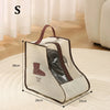 A beige boot storage bag with a brown handle and a clear window is shown on a light rug.