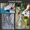 A stainless steel folding utility knife with a blade is shown next to a bottle and on denim fabric.