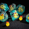 A collection of translucent teal resin dice shaped like yellow animals for tabletop role-playing games