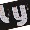 A black circuit board with a large letter U made of white LED lights and small indicator LEDs.
