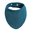 A teal organic cotton muslin baby bib with an absorbent band around the neck.