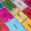 A collection of colorful RFID blocking aluminum card holders in various shades including green, pink, yellow, and blue.