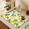 A rectangular mat featuring a pattern of lemons, leaves, and white flowers for kitchen or laundry use.