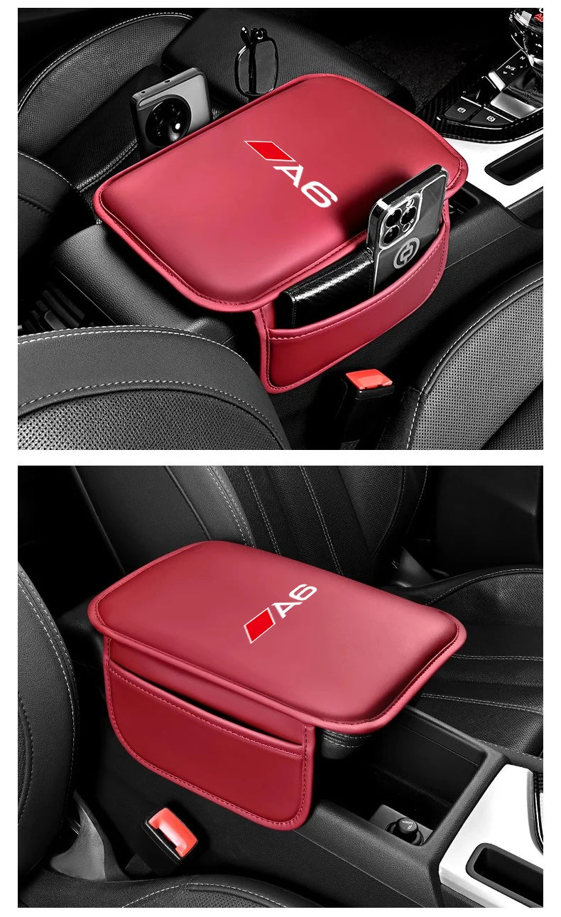 A red leather car armrest box with a storage pocket and the A6 logo placed in a car interior.