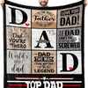 A black fleece throw blanket featuring various 'Dad' themed text designs and a man holding it.