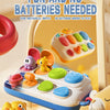 A colorful, pop-up animal sensory toy with multiple buttons and levers is shown in a bright, playful context.