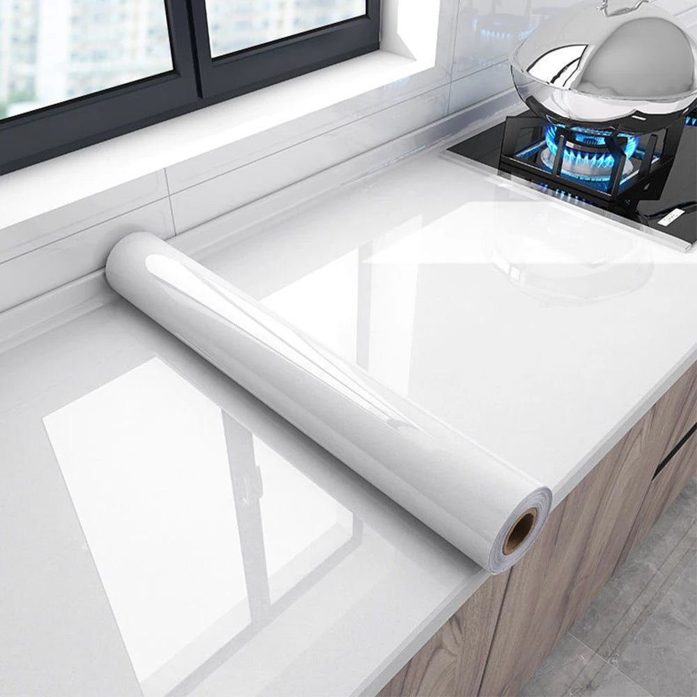 Roll of white marble peel-and-stick film for kitchen backsplash installation