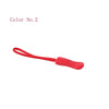 A red plastic zipper pull is shown against a white background.