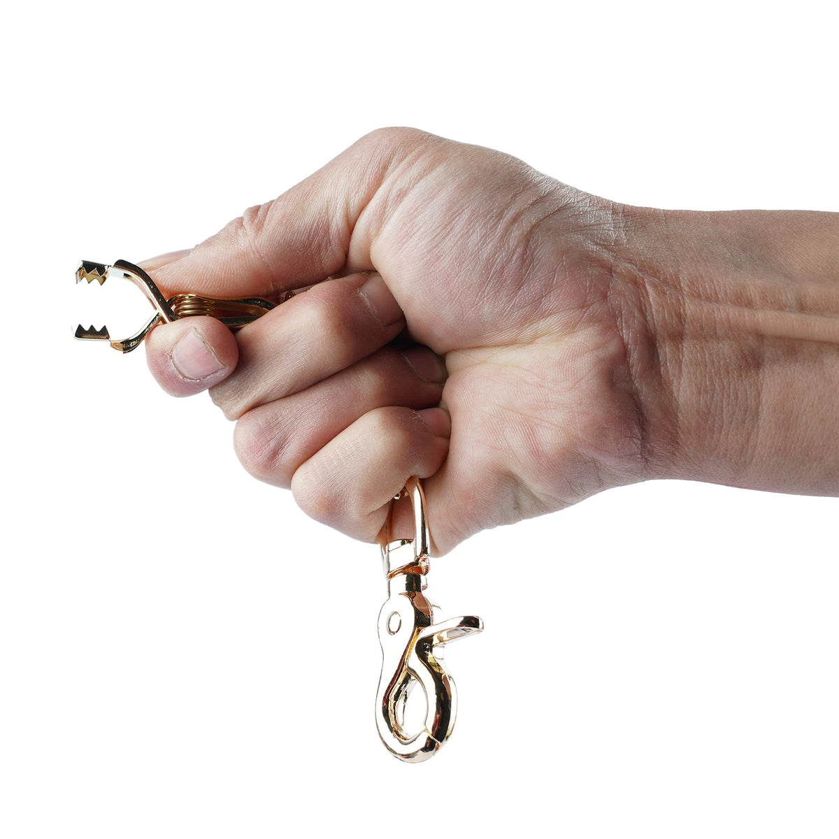 A hand holds a pair of heavy duty metal glove clips for work and outdoor use.