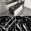 Close-up view of black and white marble contact paper showcasing intricate veining patterns.
