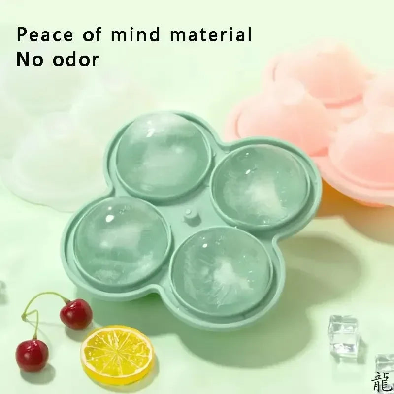 A light green silicone ice cube tray filled with clear ice cubes and a slice of lemon.