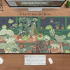 A large extended desk mat featuring a kawaii nature design of frogs and plants.