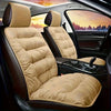 Tan plush winter car seat cover with backrest installed in a dark car interior.