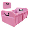 A pink foldable car trunk organizer with carry handles and multiple compartments.