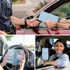 A woman is holding a blue card holder wallet while a man looks through the window of a red car.