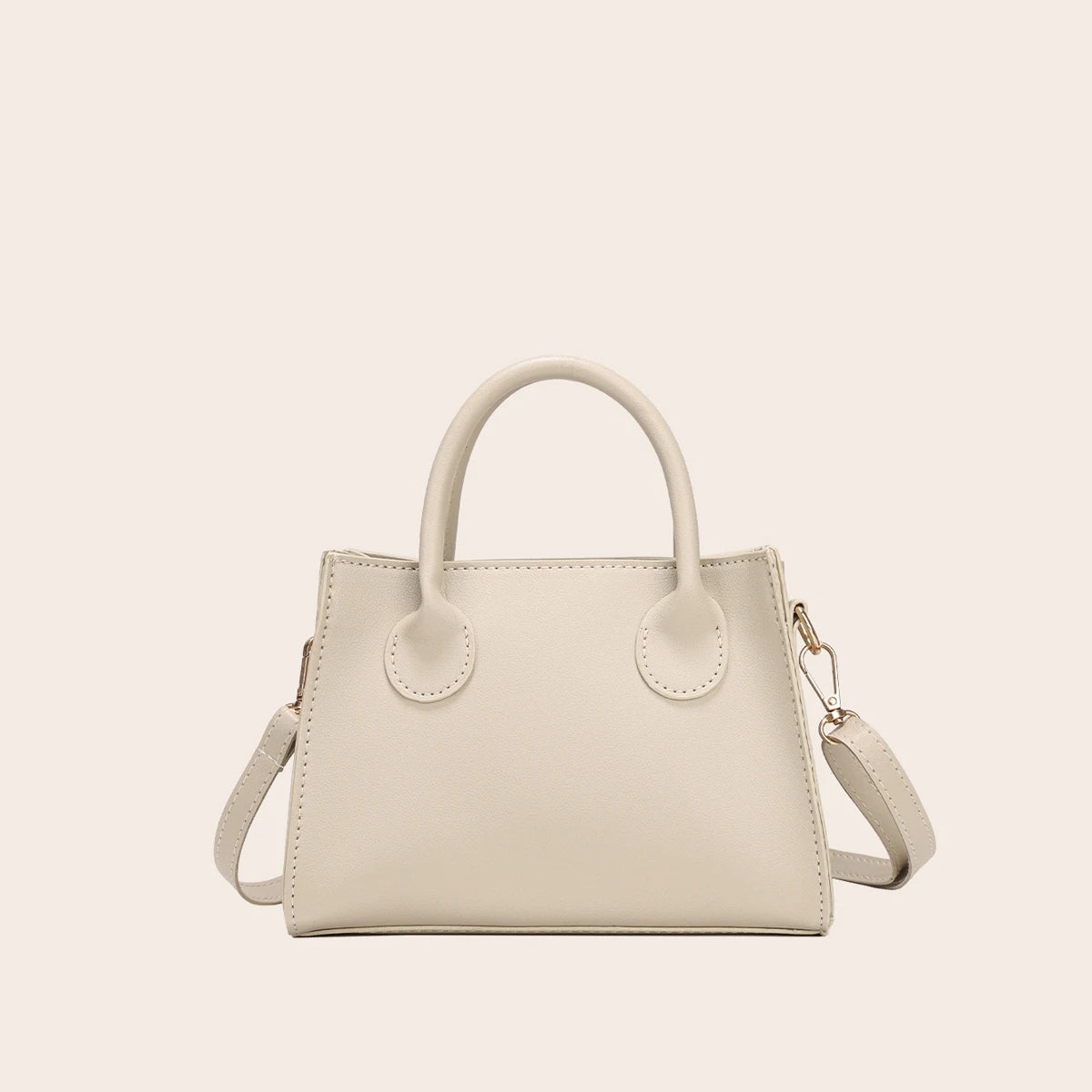 A beige classic PU leather crossbody tote bag with a top handle and gold chain detail.