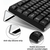 Acrylic ergonomic keyboard riser showing the keyboard and anti-slip silicone strip and smooth rounded edges.
