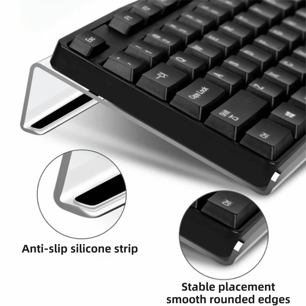 Acrylic ergonomic keyboard riser showing the keyboard and anti-slip silicone strip and smooth rounded edges.