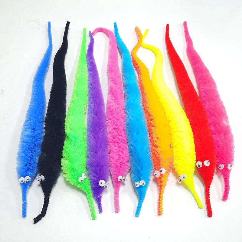 A collection of fuzzy wiggly worm magic tricks in various bright colors like blue, black, green, purple, and pink.