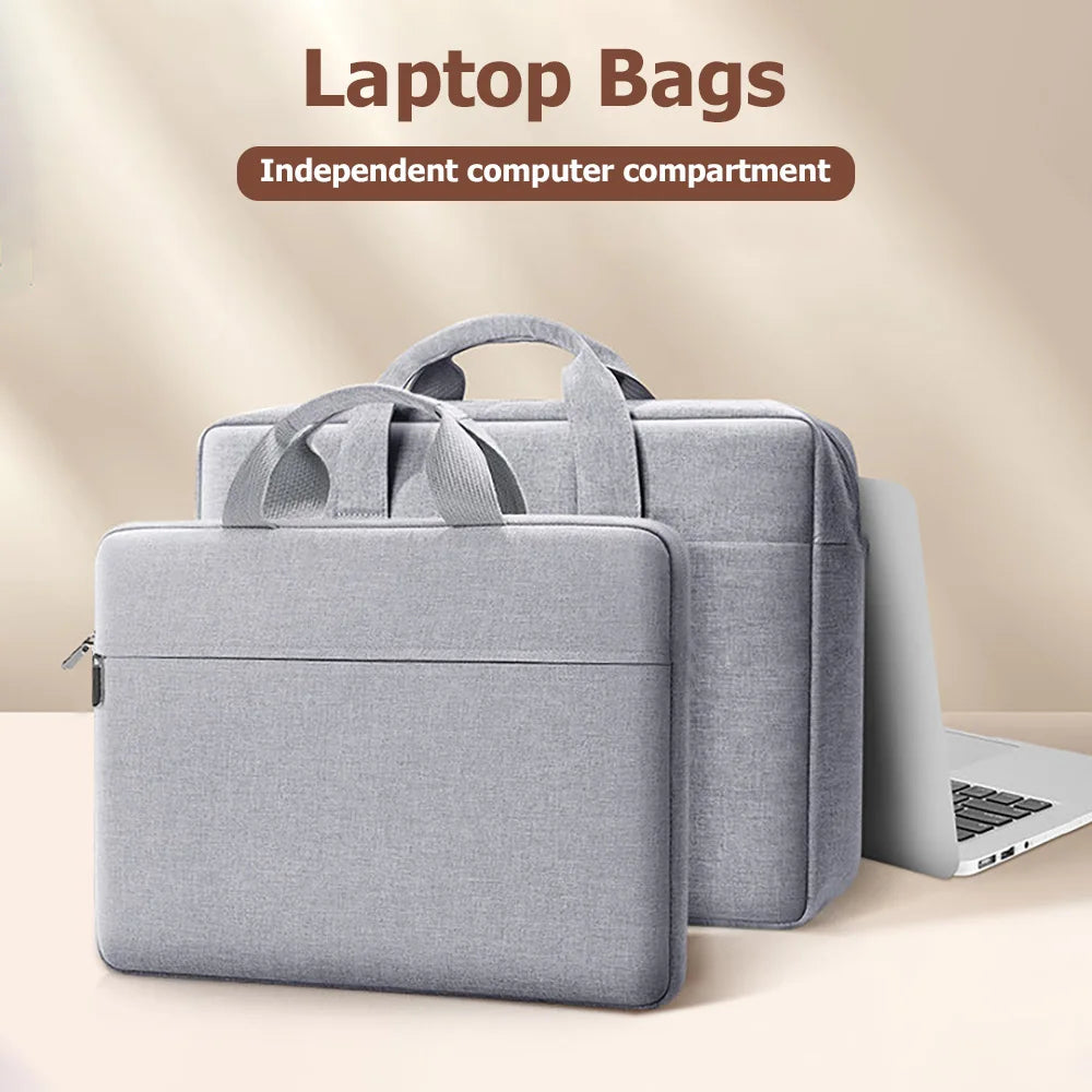 A gray laptop bag with an independent computer compartment is shown next to a silver laptop.