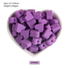 A pile of purple silicone crown star heart beads for DIY jewelry making