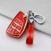 A red durable TPU car key fob cover with a silver keychain attached.