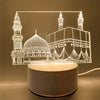 A glowing acrylic night light depicting a mosque silhouette with domes and minarets.