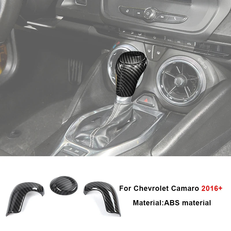Carbon fiber interior trim kit for Chevrolet Camaro featuring a leather-wrapped shifter boot and steering wheel knob.