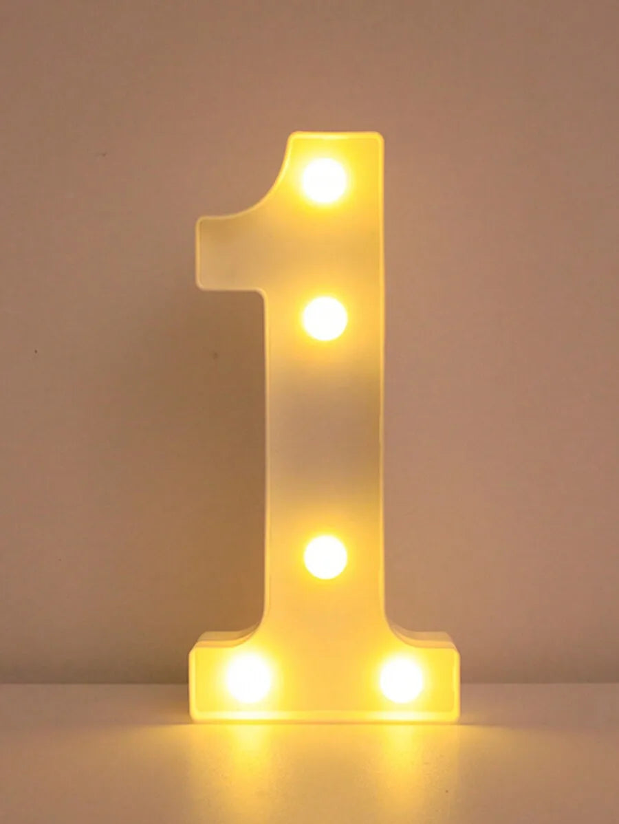A glowing yellow LED letter light shaped like the number one, used for home and party decor.