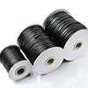 Spools of black waxed cord rope for jewelry making and DIY projects
