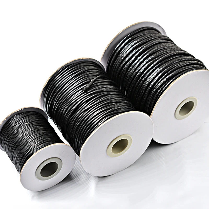 Spools of black waxed cord rope for jewelry making and DIY projects