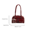 Bolso de hombro suave con detalle de lazo