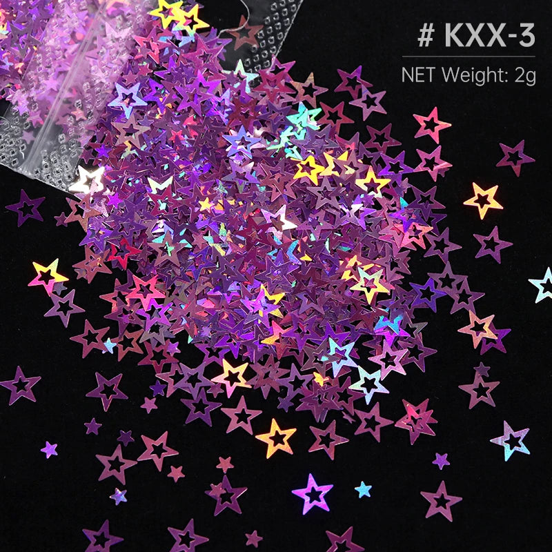 A pile of iridescent holographic star sequins in various colors scattered on a black background.