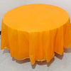 A vibrant orange disposable round tablecloth is displayed on a white surface.