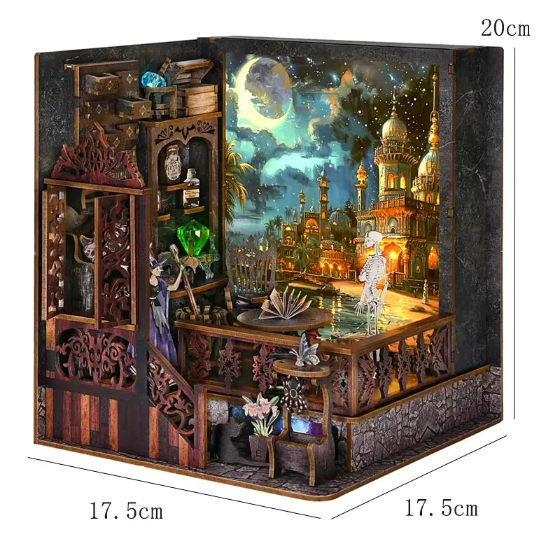 A wooden DIY book nook kit featuring a detailed miniature house scene with architecture and landscape elements.