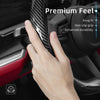 A hand grips a carbon fiber texture steering wheel cover, highlighting premium feel and durability features.