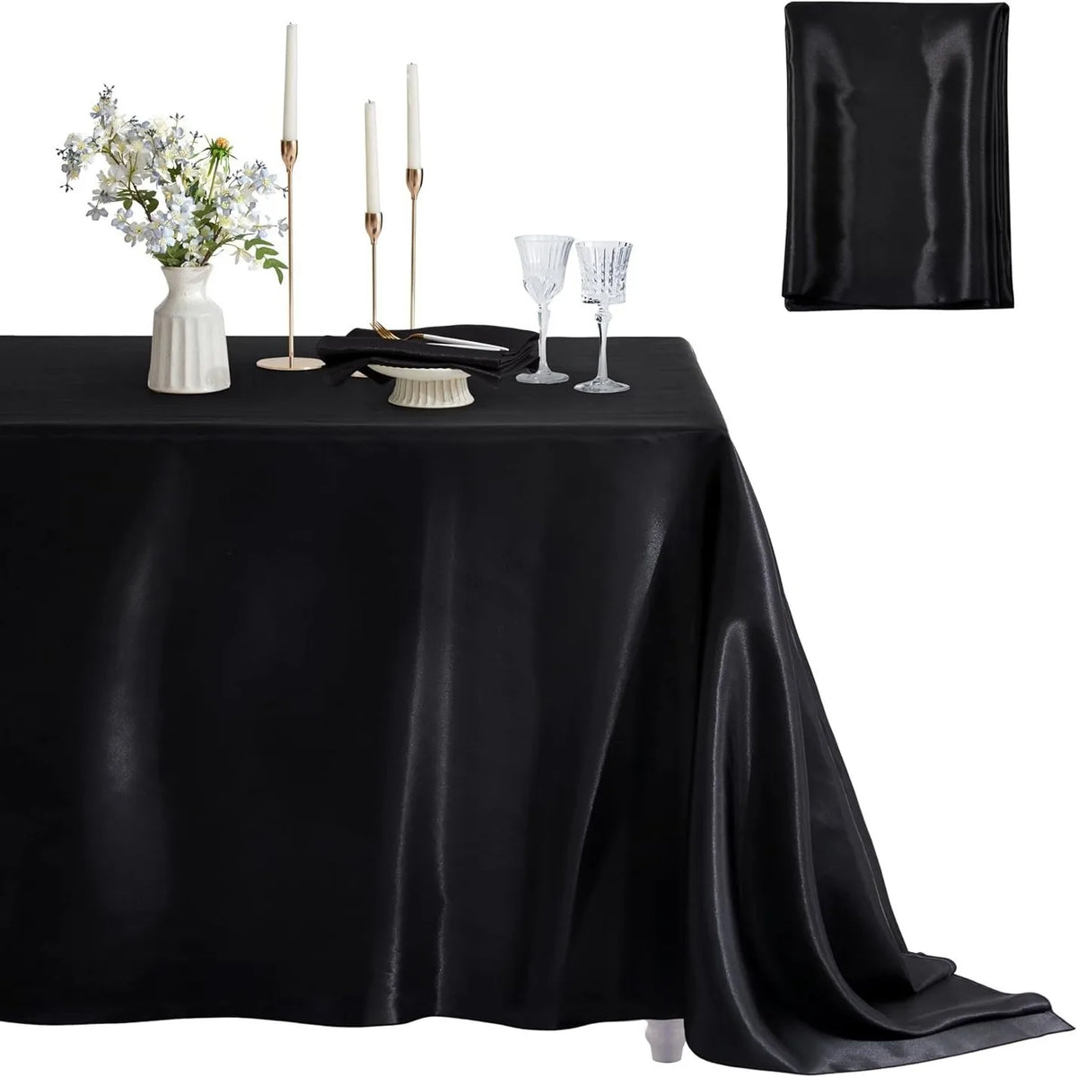 Black satin tablecloth set featuring a square cover, candles, and glassware for dining events.