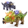 A green dinosaur toy featuring spiky skin and glowing eyes, alongside a dark gray dinosaur toy.
