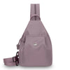 A light purple women's mini backpack with a strap and a flap closure.