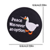Black embroidered iron-on patch featuring a white goose with text that reads Peace Was never an option.