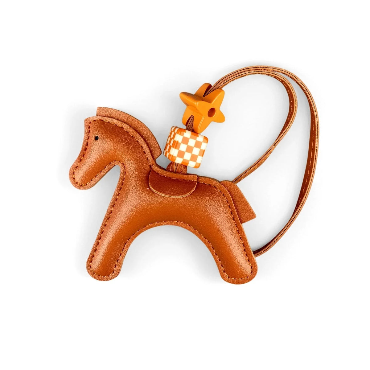 A small brown leather pony charm with a gold-colored tag and leather strap.