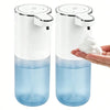 A white touchless automatic soap dispenser with a blue liquid reservoir and a white pump head is shown next to a hand dispens