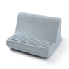 A light gray, rectangular cushion designed as an adjustable comfort tablet and phone stand pillow.
