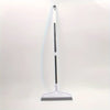 A long, slender broom with a white handle and a gray silicone scraper head is shown against a white background.