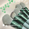 A collection of 13 makeup brushes including highlight, blush, contour, foundation, and loose powder brushes displayed on a li