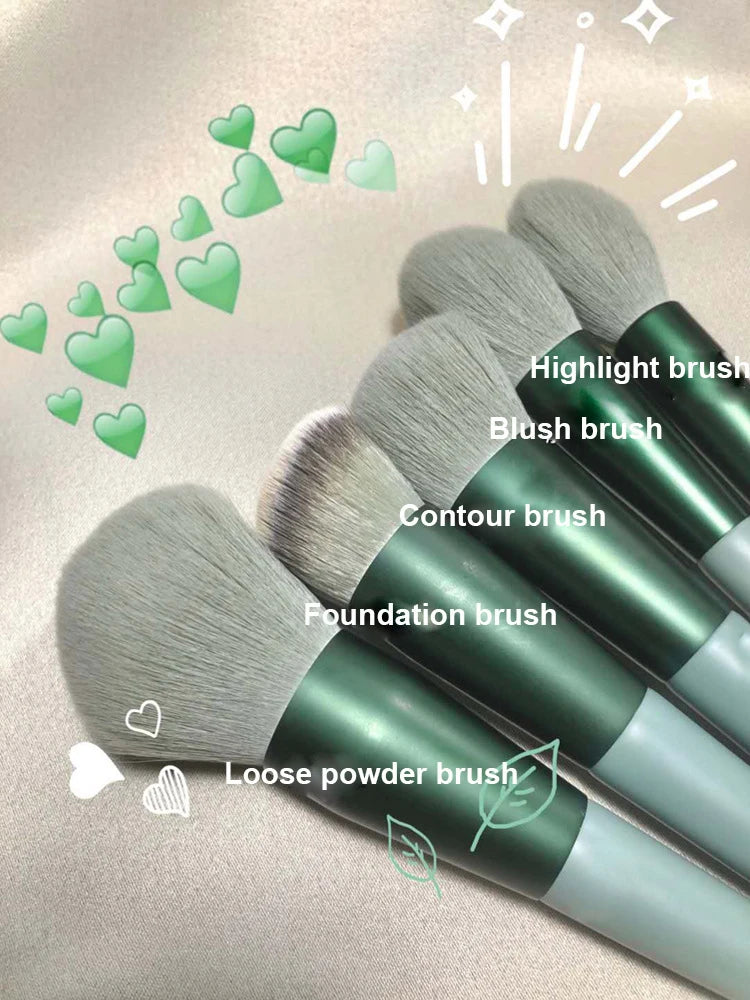 A collection of 13 makeup brushes including highlight, blush, contour, foundation, and loose powder brushes displayed on a li