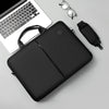 A black men's business commuter laptop briefcase with a shoulder strap and a black sleeve is shown next to a silver pair of g