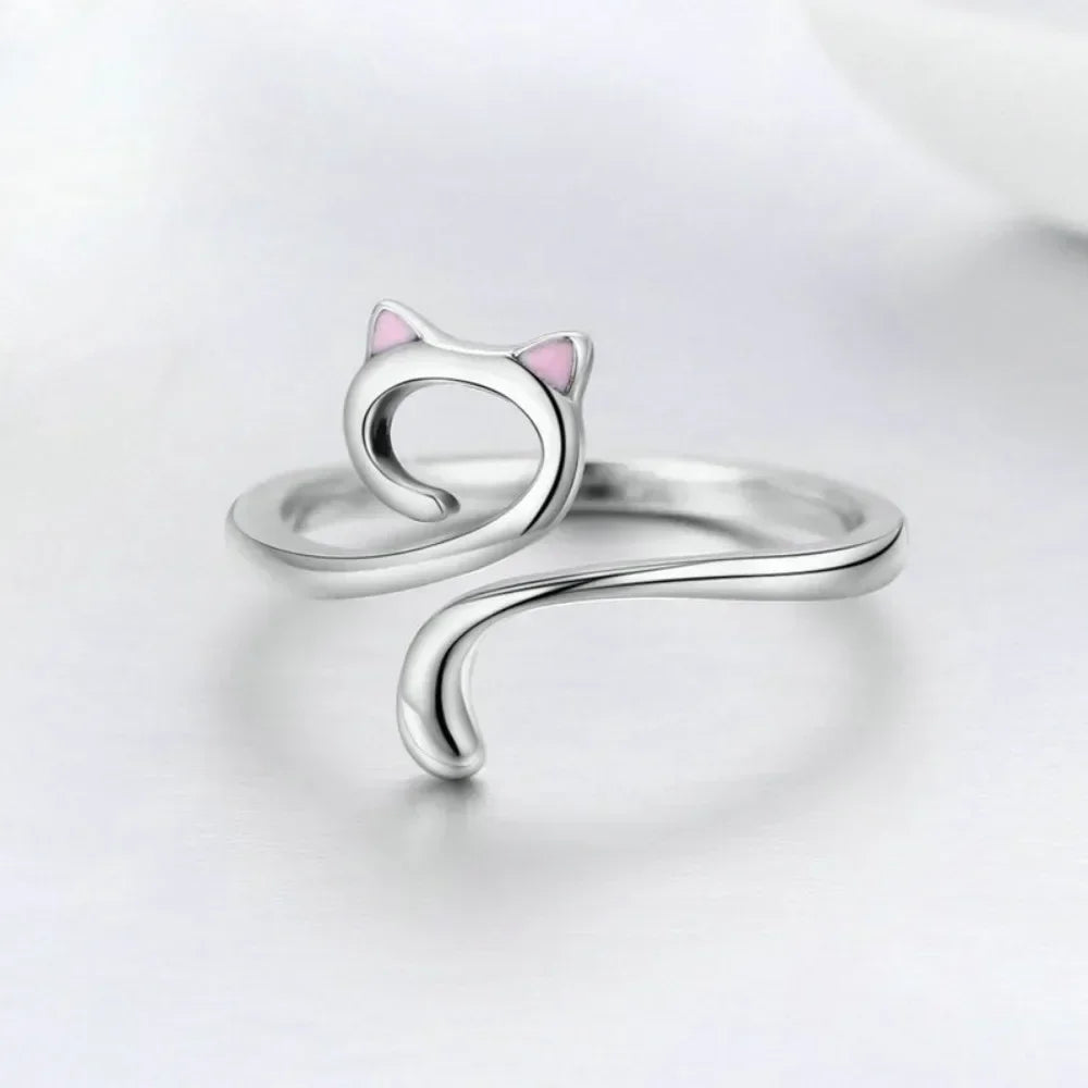 Silver adjustable cat crochet ring with a pink accent, shown on a white background.